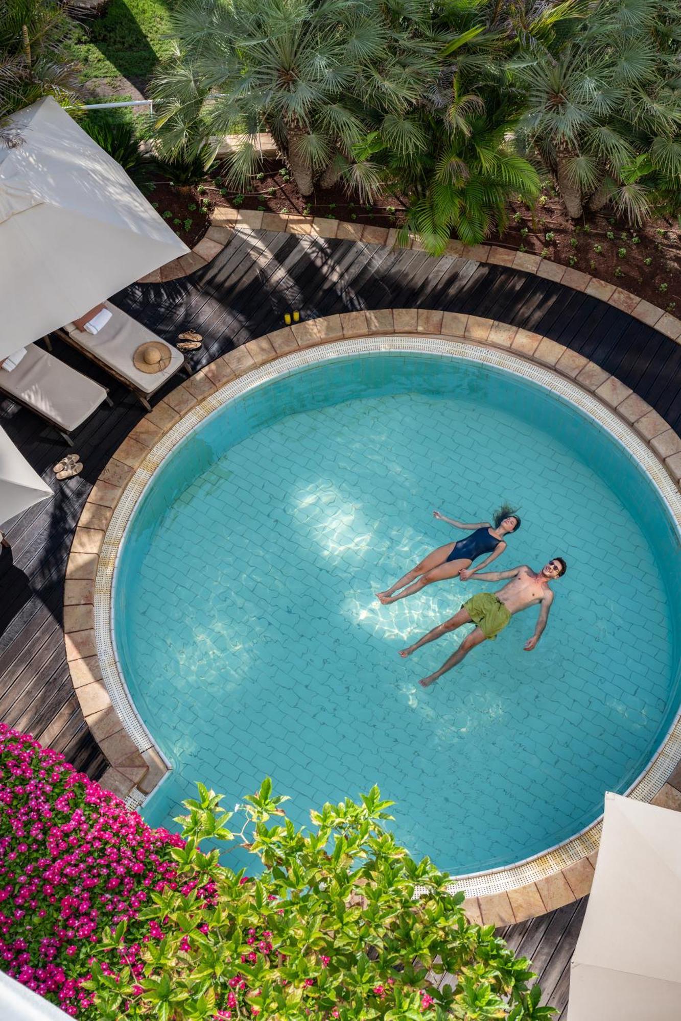 Nevo By Isrotel Collection Én-Bokek Kültér fotó The swimming pool at the hotel